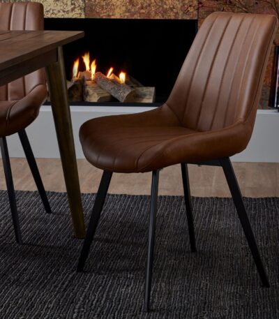 Oslo Dining Chair. Faux leather dining chair. Tan dining chair. Grey dining chair. Black leg dining chair. Modern dining chair. Scandinavian dining chair. Contemporary dining chair. Ergonomic dining chair. Cushioned dining chair. Stylish dining seating. Comfortable dining chair. Faux leather furniture. Minimalist dining room chairs. Kitchen dining chairs.