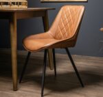 Dining Chair. Chair. Dining Table. Criss Cross. Pattern. Furniture. Seating. Tan. Faux. Leather. Legs. Metal. Black. Home. Kitchen. Bedroom. Decor. Classic. Sleek. Modern. Classic.