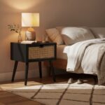 Sustainable elm wood frame. Natural rattan weave. Angular legs. Organic simplicity. Black finish. Storage drawer. Timeless aesthetic. Stylish. Functional. Living room. Bedroom. Hallway. Durable. Elegant design.