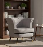 Emilia velvet chair. Scalloped accent chair. Velvet upholstery. Luxe chair. Gold finish legs. Black wood legs. Blue velvet. Pink velvet. Grey velvet. Mink velvet. Plush cushioning. Boutique style. Contemporary chair. Stylish seating. Home furniture. Living room chair. Decorative chair. Elegant furniture. Modern accent chair. Trendy home decor. Comfortable seating. Luxury chair. Designer chair.