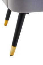 Tufted grey upholstery. Luxe chairs. Contemporary design. Plush cushioning. Boutique style. Gold finish tipped feet. Living room. Furniture. Home decor. Seating. Statement piece. Elegant. Comfortable. Stylish. Durable. High-quality materials. Modern classic. Sophisticated. Black legs. Gold tips. Unique design. Versatile. Timeless. Eye-catching. Velvet. Mira.