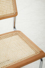 Sustainable elm wood frame. Stainless steel cantilevered frame. Natural rattan weave. Organic simplicity. Mid-century modern. Sleek design. Contemporary elegance. Durable. Comfortable. Stylish. Functional. Dining room. Modern. Rustic charm. Versatile. Long-lasting. Timeless aesthetic. Eco-friendly. Sturdy. High-quality. Furniture. Home. Kitchen. Sustainable elm wood frame. Stainless steel cantilevered frame. Natural rattan weave. Organic simplicity. Mid-century modern. Sleek design. Contemporary elegance. Durable. Comfortable. Stylish. Functional. Dining room. Modern. Rustic charm. Versatile. Long-lasting. Timeless aesthetic. Eco-friendly. Sturdy. High-quality. Furniture. Home. Kitchen. Dining. Chair.