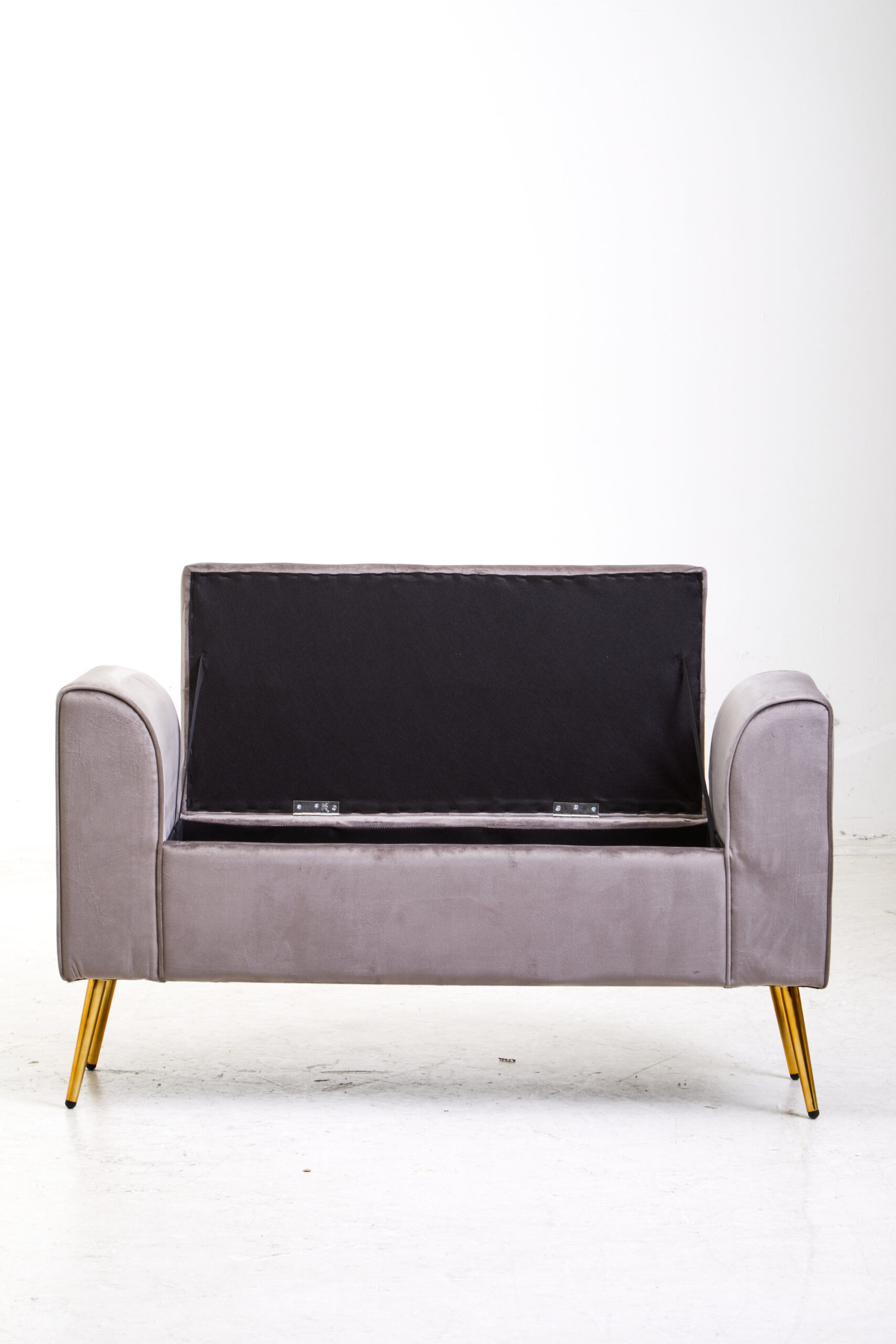 Mink velvet upholstery. Luxe seating. Angular gold finish legs. Contemporary design. Tufted seat. Iron legs. Storage solution. Living room. Bedroom. Entryway. Furniture. Home decor. Statement piece. Elegant. Comfortable. Stylish. Durable. High-quality materials. Modern classic. Sophisticated. Practical. Versatile. Timeless. Eye-catching. Velvet. Bench. Storage. Seating.