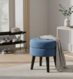 Lila footstool. Velvet footstool. Upholstered footstool. Luxury footstool. Modern footstool. Plush footrest. Boutique furniture. Blue footstool. Grey footstool. Mink footstool. Burgundy footstool. Wine red footstool. Velvet furniture. Contemporary footstool. Small ottoman. Velvet ottoman. Stylish footstool. Soft seating. Home accessories. Bedroom furniture. Living room furniture. Accent furniture. Modern interior. Black wooden legs. Cushioned stool. Velvet accent piece. Compact seating solution.