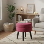 Lila footstool. Velvet footstool. Upholstered footstool. Luxury footstool. Modern footstool. Plush footrest. Boutique furniture. Blue footstool. Grey footstool. Mink footstool. Burgundy footstool. Wine red footstool. Velvet furniture. Contemporary footstool. Small ottoman. Velvet ottoman. Stylish footstool. Soft seating. Home accessories. Bedroom furniture. Living room furniture. Accent furniture. Modern interior. Black wooden legs. Cushioned stool. Velvet accent piece. Compact seating solution.