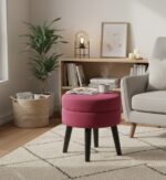Lila footstool. Velvet footstool. Upholstered footstool. Luxury footstool. Modern footstool. Plush footrest. Boutique furniture. Blue footstool. Grey footstool. Mink footstool. Burgundy footstool. Wine red footstool. Velvet furniture. Contemporary footstool. Small ottoman. Velvet ottoman. Stylish footstool. Soft seating. Home accessories. Bedroom furniture. Living room furniture. Accent furniture. Modern interior. Black wooden legs. Cushioned stool. Velvet accent piece. Compact seating solution.