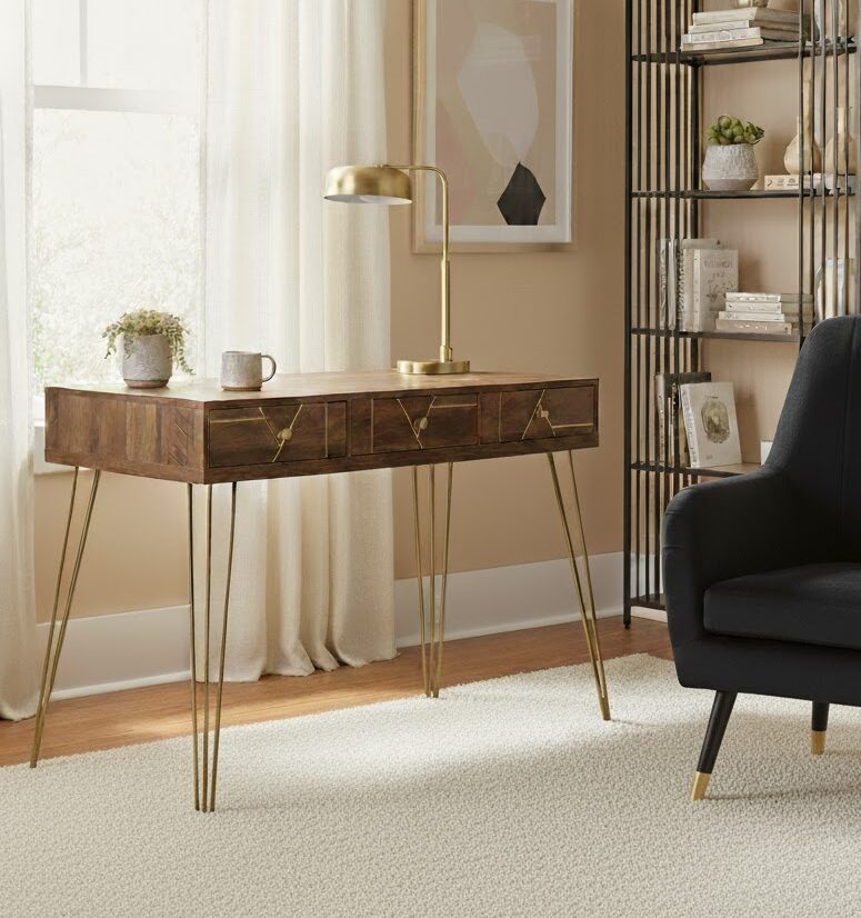 Talia Desk Talia desk. Mid-century modern desk. Wood veneer desk. Writing desk. Home office furniture. Stylish desk. Modern desk. Three drawer desk. Hairpin leg desk. Wooden desk. Contemporary furniture. Retro desk. Brown desk. Compact home desk. Warm metallic legs. Desk with storage. Vintage style desk. Small office desk. Wooden home office furniture. Metal leg desk. Storage solution. Classic desk design. Home study furniture. Workspace furniture. Rustic finish desk.