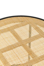 Dakota side table. Round side table. Natural rattan. Hand-woven rattan. Organic texture. Black metal legs. Sleek design. Minimalist furniture. Natural living. Home decor. Living room furniture. Modern side table. Contemporary furniture. Black finish. Rattan furniture. Lightweight table.