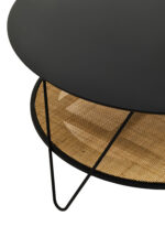 Dakota Coffee Table. Black metal table. Natural rattan shelf. Hairpin legs. Round coffee table. Storage shelf. Organic texture. Modern furniture. Natural living. Minimalist design. Home furniture. Living room table. Durable coffee table. Contemporary style. Black furniture. Rattan furniture. Sleek design.