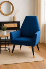 Camille velvet armchair. Grey armchair. Blue armchair. Velvet upholstery. Button detail. Gold-tipped legs. Black wooden legs. Luxe accent chair. Modern chair. Retro style. Boutique furniture. Plush cushioning. Living room chair. Home furniture. Stylish seating. Contemporary design. Velvet accent chair. Upholstered armchair. Comfortable seating. Decorative chair. Elegant furniture. Designer chair. Soft fabric chair. Trendy home decor. Modern living room furniture. Luxury chair. Blue velvet. Grey velvet. Wooden legs. Gold finish legs. Stylish armchair. Interior design furniture.