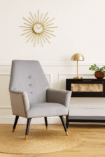 Camille velvet armchair. Grey armchair. Blue armchair. Velvet upholstery. Button detail. Gold-tipped legs. Black wooden legs. Luxe accent chair. Modern chair. Retro style. Boutique furniture. Plush cushioning. Living room chair. Home furniture. Stylish seating. Contemporary design. Velvet accent chair. Upholstered armchair. Comfortable seating. Decorative chair. Elegant furniture. Designer chair. Soft fabric chair. Trendy home decor. Modern living room furniture. Luxury chair. Blue velvet. Grey velvet. Wooden legs. Gold finish legs. Stylish armchair. Interior design furniture.