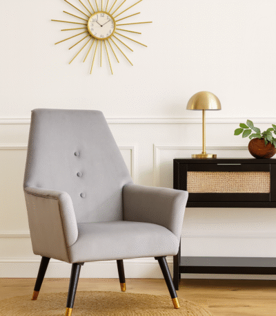 Camille velvet armchair. Grey armchair. Blue armchair. Velvet upholstery. Button detail. Gold-tipped legs. Black wooden legs. Luxe accent chair. Modern chair. Retro style. Boutique furniture. Plush cushioning. Living room chair. Home furniture. Stylish seating. Contemporary design. Velvet accent chair. Upholstered armchair. Comfortable seating. Decorative chair. Elegant furniture. Designer chair. Soft fabric chair. Trendy home decor. Modern living room furniture. Luxury chair. Blue velvet. Grey velvet. Wooden legs. Gold finish legs. Stylish armchair. Interior design furniture.