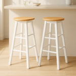 Bar stool. Kitchen stool. Wooden bar stool. Natural wood. A-frame legs. Black. White. Grey. Modern rustic furniture. Home furniture. Seating. Counter stool. Bar seating. Minimalist furniture. Scandi style. Farmhouse bar stool. Breakfast bar chair. Footrest stool. Compact bar stool. Solid wood stool. Contemporary seating.