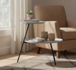 side table. 2 tier table. iron side table. minimalist furniture. black iron legs. white table. grey table. contemporary table. modern home décor. compact table. living room furniture. bedroom furniture. monochrome furniture. stylish side table. metal frame table. small space furniture. home accessories. interior design. functional furniture. sleek furniture.