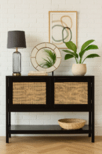 Nero Side Cabinet. Black furniture. Wood cabinet. Natural rattan panels. Storage solution. Two closed shelves. Undershelf. Modern home furniture. Warm aesthetic. Earthy tones. Contemporary design. Living room storage. Bedroom furniture. Stylish cabinet. Practical storage. Minimalist cabinet. Durable wood. Eco-friendly materials. Home organisation.