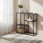 Axel Multi Shelf Unit. Black shelf unit. Grey shelf unit. Metal shelf unit. Powder coated shelf. Open shelving unit. Industrial shelf unit. Minimalist shelving. Multi tier storage. Modern shelf design. Metal storage furniture. Contemporary shelf unit. Industrial home décor. Versatile storage solution. Openwork shelving. Living room shelves. Hallway storage. Sleek metal shelving. Home organisation furniture. Loft style shelving. Adjustable tier shelves. Display unit. Black and grey furniture. Metal shelving unit. Powder-coated metal furniture.