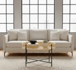 Dakota. Coffee Table. Natural Rattan. Hand Woven. Black Metal Base. Round Table. Cross Base. Organic Texture. Natural Living. Living Room Furniture. Home Decor. Sleek Design. Minimalist. Contemporary. Brown. Black. Natural Colors.