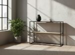 Dakota console table. Black metal console. Natural rattan shelf. Minimalist furniture. Modern console table. Storage furniture. Natural living. Home decor. Sleek design. Contemporary console. Black and rattan. Living room furniture. Entryway table. Small console table. Durable metal frame.