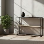 Dakota console table. Black metal console. Natural rattan shelf. Minimalist furniture. Modern console table. Storage furniture. Natural living. Home decor. Sleek design. Contemporary console. Black and rattan. Living room furniture. Entryway table. Small console table. Durable metal frame.
