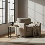 Dakota side table. Round side table. Natural rattan. Hand-woven rattan. Organic texture. Black metal legs. Sleek design. Minimalist furniture. Natural living. Home decor. Living room furniture. Modern side table. Contemporary furniture. Black finish. Rattan furniture. Lightweight table.