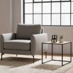 Dakota. Side table. Natural rattan. Hand-woven. Square webbing. Black metal frame. Minimalist furniture. Natural living. Home décor. Living room. Organic texture. Sleek design. Rustic style. Eco-friendly furniture. Small table. Accent table. Modern rustic. Sustainable materials.