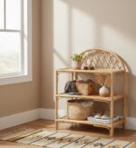 Lazaro shelf unit. 3 tier shelf. Natural rattan furniture. Rattan storage. Natural living. Arched back shelf. Rectangular shelves. Home storage. Eco-friendly furniture. Rustic decor. Boho furniture. Natural wood finish. Brown rattan. Minimalist shelving. Durable rattan. Living room storage. Bedroom storage. Stylish shelving. Sustainable furniture. Handcrafted shelf.