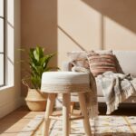 Lior Woven Stool. Natural woven seat. Two-tone design. White accents. Angular wooden legs. Durable seating. Stylish stool. Natural materials. Handcrafted. Eco-friendly. Contemporary design. Minimalist style. Natural living. Home furniture. Accent stool. Lightweight. Versatile seating. Textured pattern. Organic texture. Rustic charm. Scandinavian style. Modern home.