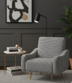 Bailey Armchair. Black Armchair. Checkered Armchair. Black and White Chair. Modern Armchair. Upholstered Chair. Gold Legs Chair. Slanted Legs. Contemporary Seating. Living Room Furniture. Accent Chair. Bedroom Chair. Statement Chair. Designer Chair. Stylish Home Furniture. Soft Fabric Chair. Comfortable Armchair. Compact Chair. Lounge Chair. Home Decor. Modern Interior. Bold Pattern Chair. Minimalist Chair.