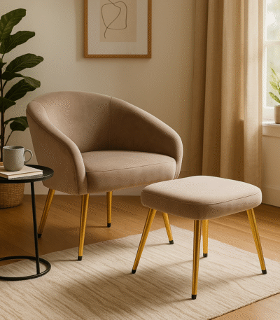 Esme Chair and Footstool. Velvet Chair. Velvet Footstool. Mink Chair. Cream Chair. Blue Chair. Mid-Century Modern Furniture. Upholstered Chair. Ergonomic Chair. High Density Foam. Gold Powder-Coated Legs. Stylish Seating. Living Room Furniture. Bedroom Chair. Compact Seating. Luxury Home Furniture. Cozy Chair. Accent Chair. Decorative Footstool. Comfortable Seating. Modern Home Decor.