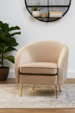 Esme Round Velvet Armchair. Velvet Armchair. Cream Velvet Chair. Mink Velvet Chair. Light Blue Velvet Chair. Mid-Century Modern Chair. Upholstered Armchair. High Density Foam Cushion. Plush Velvet Seating. Gold Metal Legs Chair. Stylish Accent Chair. Compact Armchair. Home Furniture. Modern Living Room Chair. Cozy Seating. Elegant Lounge Chair. Decorative Chair. Bedroom Chair. Office Accent Chair. Soft Velvet Upholstery. Comfortable Armchair. Tactile Texture Chair. Luxury Home Seating. Glamorous Chair.