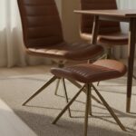 marco leather footstool. modern leather ottoman. genuine leather footstool. leather stool for living room. compact leather footrest. durable leather ottoman seat. stylish leather footstool. leather stool for modern homes. leather footrest with cushion. square leather footstool. footstool for sofa. leather accent stool. minimal leather footstool design. tan leather footrest. padded leather stool. leather stool with sturdy base. versatile leather footrest. small leather ottoman. elegant leather stool. leather footrest for bedroom. gold finish iron slanted legs.