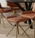 marco leather footstool. modern leather ottoman. genuine leather footstool. leather stool for living room. compact leather footrest. durable leather ottoman seat. stylish leather footstool. leather stool for modern homes. leather footrest with cushion. square leather footstool. footstool for sofa. leather accent stool. minimal leather footstool design. grey leather footrest. padded leather stool. leather stool with sturdy base. versatile leather footrest. small leather ottoman. elegant leather stool. leather footrest for bedroom. gold finish iron slanted legs.