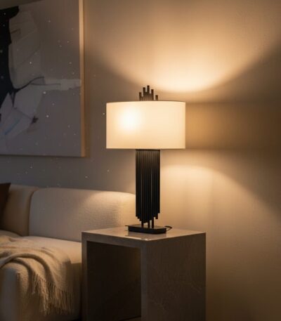 home. lighting. table lamp. contemporary design. modern lighting. sculptural lamp. asymmetric lamp. black lamp. gold lamp. fabric shade. linen shade. ambient lighting. decorative lighting. iron lamp. minimalist decor. living room lighting. bedroom lighting. stylish home accessories. modern table lamp. Avela lamp. home accents.