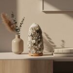 Avelina salt lamp. Grey salt lamp. Natural salt lamp. Calming light. Wood base lamp. Modern salt lamp. Decorative lighting. Wellness decor. Ambient light. Oblong salt lamp. Grey crystal lamp. Natural decor. Meditation light. Himalayan style lamp. Bedroom lighting. Boho home accessories. Soft glow lamp. Nature-inspired lighting. Handcrafted lamp. Zen home accents.