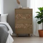 Silas drawer chest. 5 drawer chest. Wooden chest of drawers. Oak chest. Elm wood furniture. Geometric drawers. Natural wood grain. Bedroom storage. Living room chest. Modern rustic furniture. Brass finish legs. Mid-century chest. Tall storage chest. Wooden storage unit. Natural tone furniture. Functional bedroom furniture. Contemporary drawer unit. Stylish chest. Oak and elm drawer chest. Subtle pattern furniture.