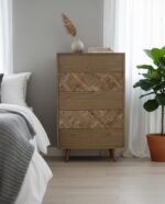 Silas drawer chest. 5 drawer chest. Wooden chest of drawers. Oak chest. Elm wood furniture. Geometric drawers. Natural wood grain. Bedroom storage. Living room chest. Modern rustic furniture. Brass finish legs. Mid-century chest. Tall storage chest. Wooden storage unit. Natural tone furniture. Functional bedroom furniture. Contemporary drawer unit. Stylish chest. Oak and elm drawer chest. Subtle pattern furniture.