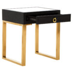 Cardoba Shagreen Bedside Table. Black shagreen leather. Gold U-shaped legs. Knocker-style handle. Modern nightstand. Luxury bedside table. Contemporary furniture. Textured finish. Durable frame. Boutique bedroom décor.