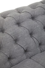 Nala 3 Seater Linen Sofa. Grey linen sofa. Button-tufted sofa. Scrolled arm sofa. Classic linen couch. Modern living room furniture. Elegant three-seater. Nailhead trim sofa. Comfortable padded sofa. Transitional design.