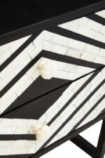 Casia Bedside Table. Bone inlay bedside table. White bone inlay furniture. Black wood base. Floral drawer grips. Modern nightstand. Handcrafted side table. Contemporary bedroom furniture. Global-inspired décor. Luxury accent table.