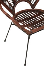 Milan Rattan Chair. Handwoven rattan furniture. Brown rattan chair. Sculptural rattan backrest. Black metal legs. Rustic boho seating. Natural handcrafted furniture. Coastal accent chair. Artisan-made rattan chair. Contemporary organic design.