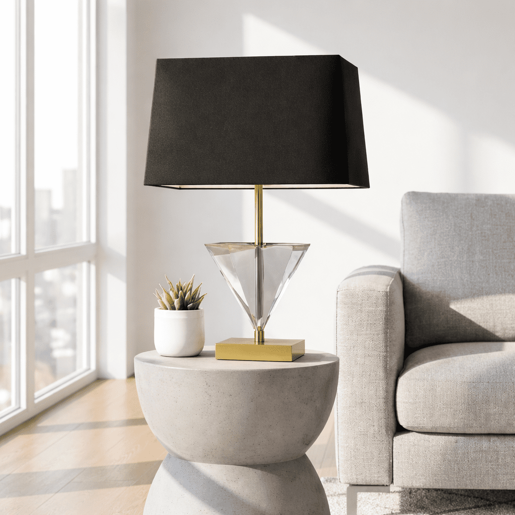Alina Smoked Crystal Table Lamp Alina Smoked Crystal Table Lamp. Triangular Crystal Lamp. Gold Metal Lamp. Black Shade Lamp. Geometric Table Lamp. Modern Accent Lamp. Luxury Table Lamp. Contemporary Lighting. Sleek Table Lamp. Living Room Lamp. Bedroom Lamp. Desk Lamp. Boutique Style Lamp. Designer Table Lamp. Sculptural Lamp. Ambient Lighting. Modern Home Accessory. Minimalist Lamp. Statement Table Lamp. Elegant Table Lamp.