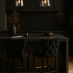 Amani Bar Stool. Black fabric bar stool. Upholstered stool. Rubberwood legs. Modern bar seating. Padded bar stool. Contemporary bar furniture. Metal footrest stool. Scandinavian style seating. Minimalist design.