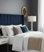 Azelina Table Lamp. Ribbed glass lamp. Silver metal base. Ivory fabric shade. Modern lighting. Contemporary table lamp. Elegant lamp décor. Neutral lighting accessory. Glass and metal lamp. Ambient lighting. Bedroom lamp. Living room table lamp. Designer lighting.