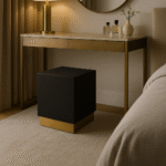 Corina Square Shagreen Stool. Square shagreen stool. Luxury accent stool. Black and gold stool. Textured leather stool. Modern footstool. Art deco stool. Bedroom accent stool. Living room stool. Boutique style furniture. Luxury seating. Contemporary home furniture. Designer stool. Metallic base stool. Compact accent furniture.