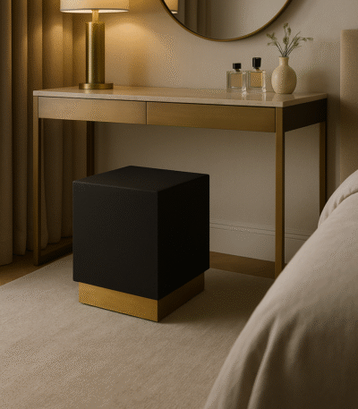 Corina Square Shagreen Stool. Square shagreen stool. Luxury accent stool. Black and gold stool. Textured leather stool. Modern footstool. Art deco stool. Bedroom accent stool. Living room stool. Boutique style furniture. Luxury seating. Contemporary home furniture. Designer stool. Metallic base stool. Compact accent furniture.