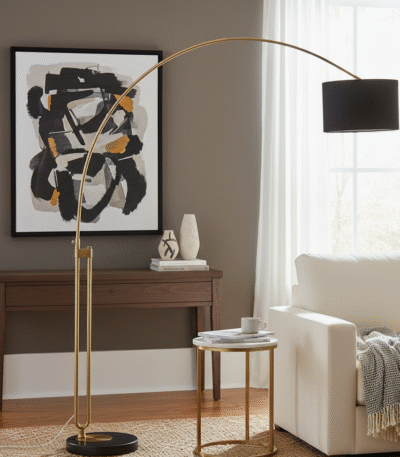 Syra Floor Lamp. Arched Brass Floor Lamp. Black Marble Base Lamp. Black Fabric Shade Lamp. Contemporary Floor Lamp. Modern Home Lighting. Reading Floor Lamp. Ambient Lighting Feature. Boutique Style Lamp. Luxury Floor Lamp. Statement Lighting. Living Room Floor Lamp. Bedroom Floor Lamp. Elegant Home Lighting. Antique Brass Finish Lamp.