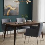 Thalia Dining Chair. Faux leather dining chair. Gold leg chair. Quilted back chair. Dark grey chair. Modern dining furniture. Mid-century modern style. Contemporary seating. Padded armchair. Elegant dining chair. Chrome finish legs. Stylish home décor.