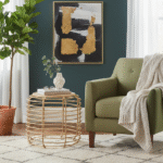 Trent Coffee Table. Rattan coffee table. Handwoven rattan top. Gold metal frame table. Round coffee table. Minimalist living room furniture. Boho coffee table. Coastal style furniture. Mid-century modern table. Sturdy metal frame. Artisanal furniture. Rustic modern décor.