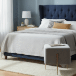 Vienna Square Velvet Stool. Velvet stool. Grey velvet stool. Square pouffe. Luxury accent stool. Modern footstool. Gold leg stool. Contemporary home furniture. Bedroom accent stool. Living room stool. Glam interior furniture. Vanity stool. Compact seating. Upholstered stool. Designer stool.