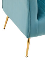 Pia Velvet Accent Chair. Green velvet chair. Gold legs accent chair. Modern velvet armchair. Channel tufted chair. Luxury accent seating. Contemporary velvet furniture. Stylish green chair. Winged backrest chair. Slanted leg design. Plush foam seat. Boutique home decor. Elegant living room chair. Modern bedroom seating. Velvet statement chair. Art deco inspired furniture. Gold finish accent chair. Designer velvet armchair. Soft padded chair. Modern home furniture.